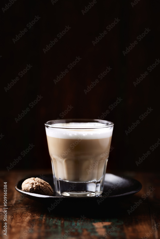 Coffee with milk on dark wooden background. Soft focus. Copy space. Coffee with milk on dark wooden background. Soft focus. Copy space.