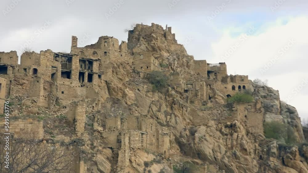 Ruins of abandoned ghost village Gamsutl at top of mountain peak in Dagestan, Russia Ruins of abandoned ghost village Gamsutl at top of mountain peak in Dagestan, Russia