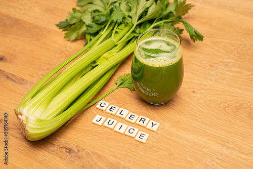 Celery Juice letters on wood background