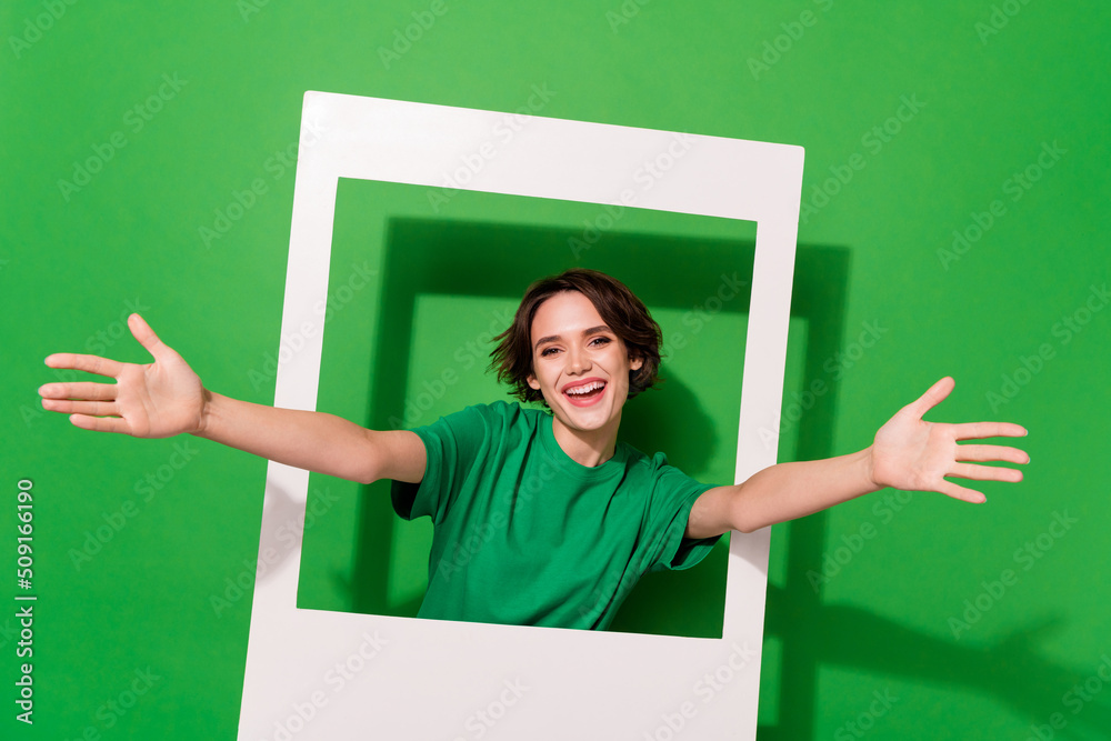 Photo of friendly kind person raise opened arms camera you invite isolated on green color background