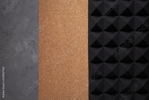 Acoustic soundproof foam and cork board at cement wall background texture. Sound isolation material