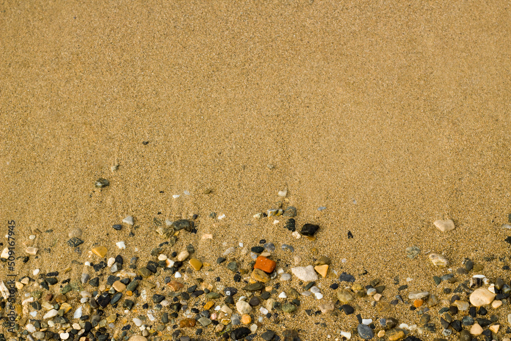 Wet, clean, sandy and stony beach background,top view Wet, clean, sandy and stony beach background,top view