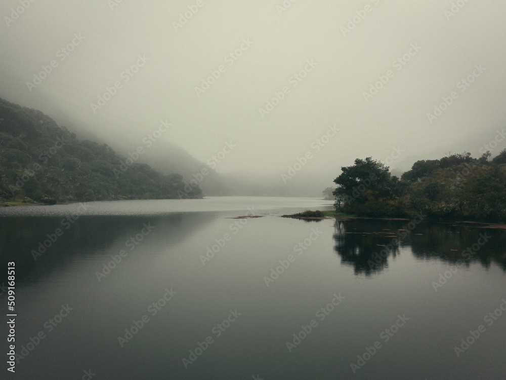 Beautiful lake under the cold mist of paramo