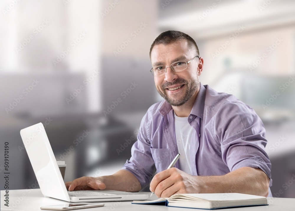 Happy business man remote teacher, customer support manager wearing headset talking at virtual meeting consulting client on video call giving distance learning class at home office call center. Happy business man remote teacher, customer support manager wearing headset talking at virtual meeting consulting client on video call giving distance learning class at home office call center.