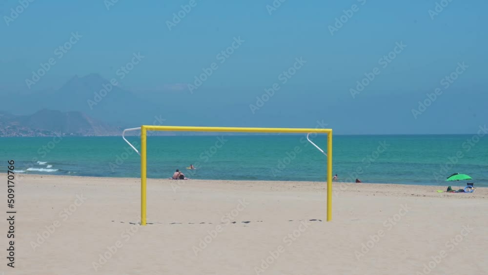A yellow football goal, also known as football gate, is seen at the beach on the shore of the Mediterranean sea in Alicante, Spain. A yellow football goal, also known as football gate, is seen at the beach on the shore of the Mediterranean sea in Alicante, Spain.