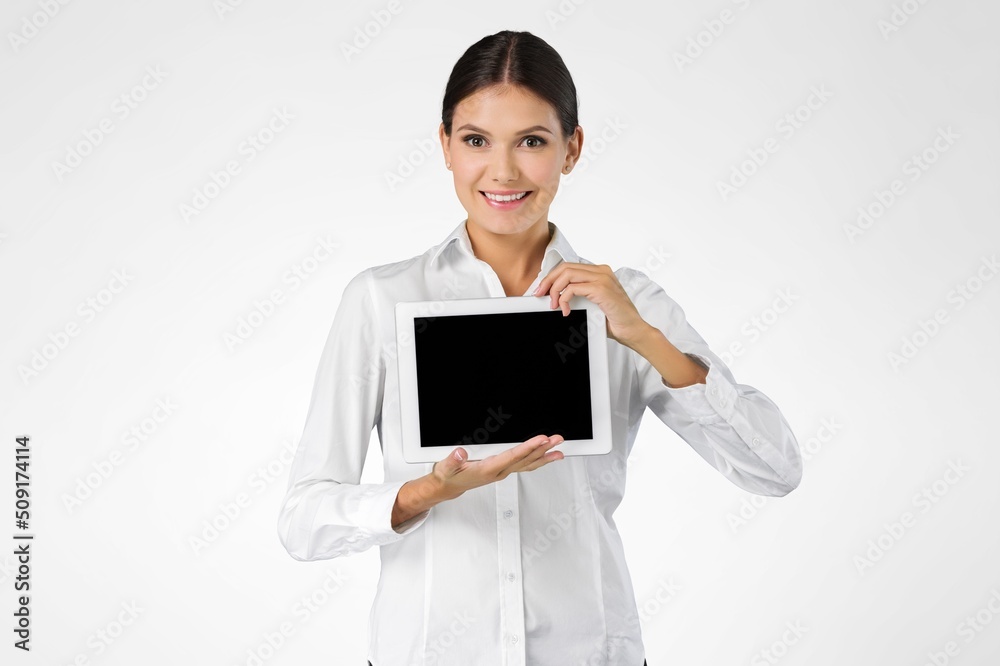 Image of young woman, company worker, smiling , standing over background Image of young woman, company worker, smiling , standing over background