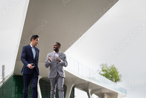 White collar workers meeting outdoors in a city