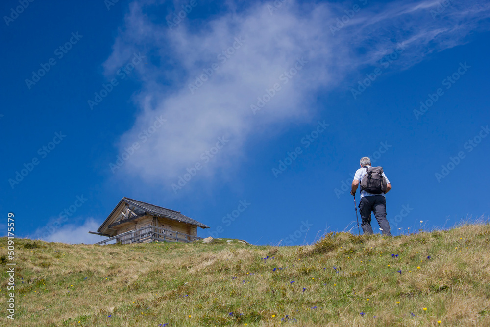 Obraz premium man trekking in the mountains, Alps in Austria, Lienzer Dolomiten