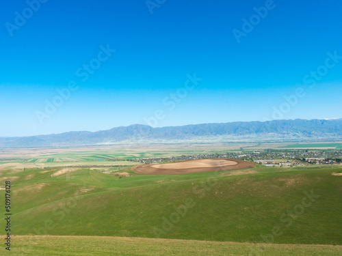 Green slopes and blue skies. Kyrgyzstan. tourism and travel © Alwih