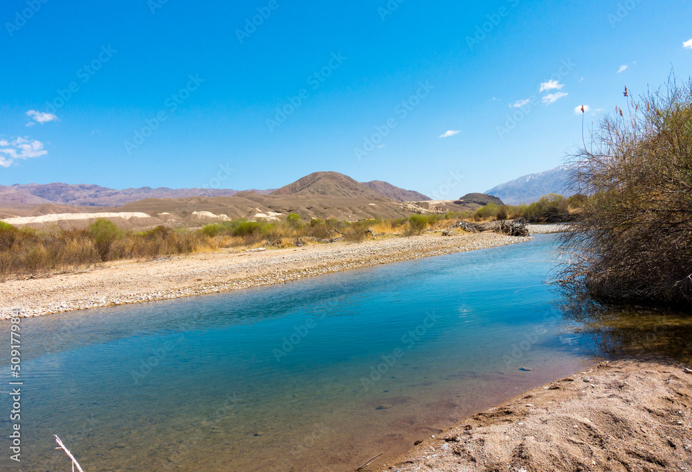 River among the mountains. Calm transparent ovda. Summer landscape. Boom Gorge, Kyrgyzstan. River among the mountains. Calm transparent ovda. Summer landscape. Boom Gorge, Kyrgyzstan.