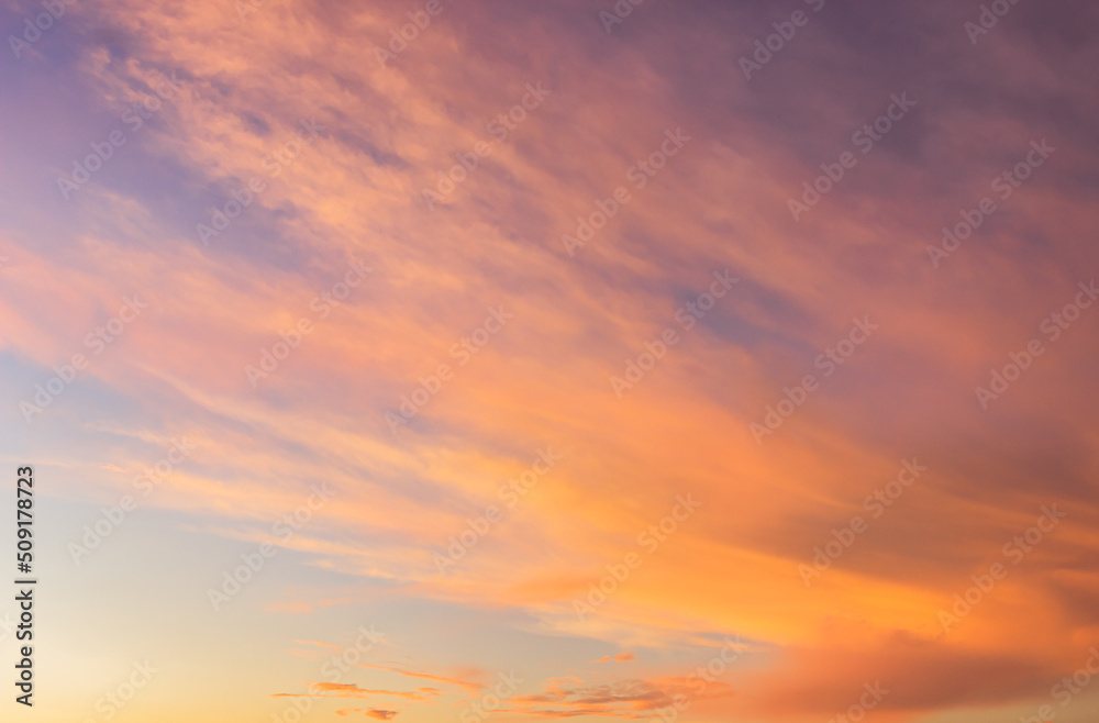 Sunset sky with orange sunrise on blue sky background in the morning.