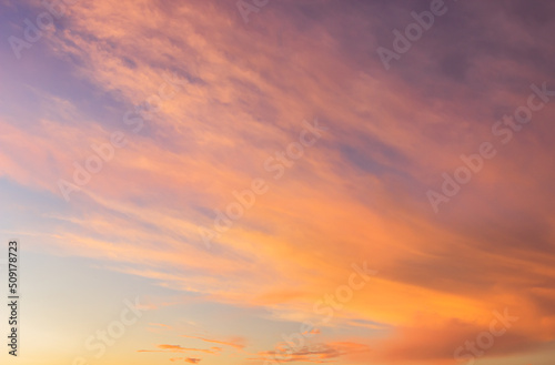Sunset sky with orange sunrise on blue sky background in the morning. © Nature Peaceful 