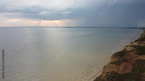 Rays of the setting sun over a wide river. High quality aerial FullHD footage
