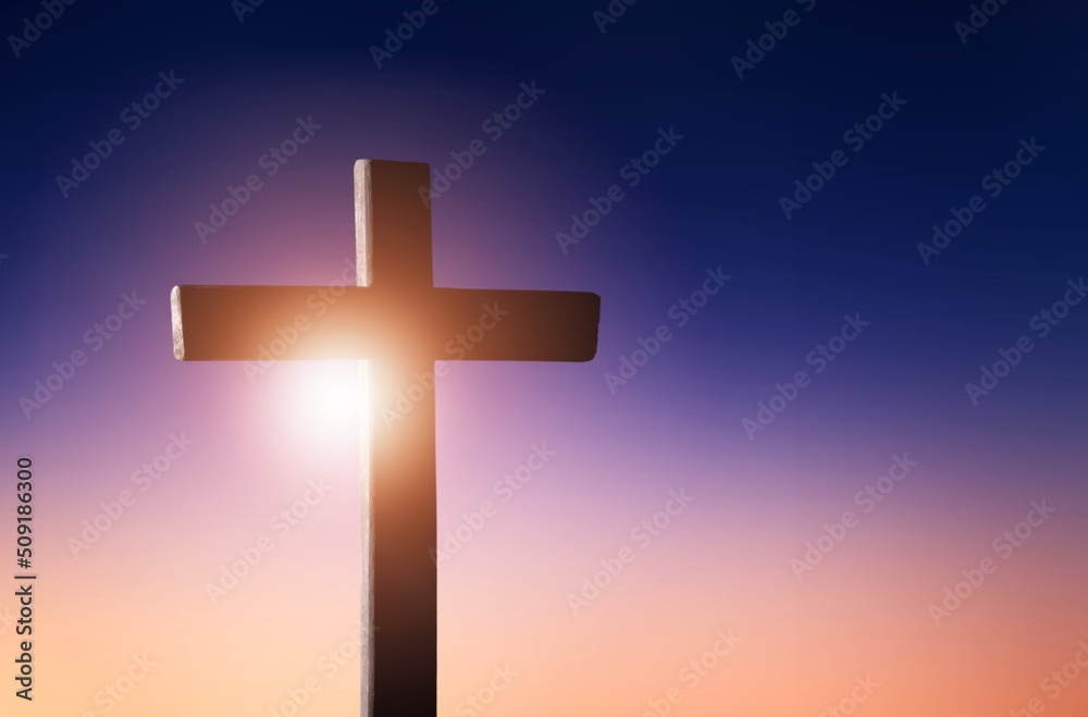 Classic wooden cross on color background