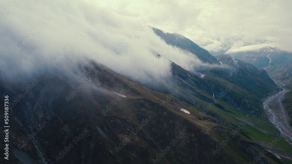 clouds over Caucasus mountains, Kazbegi, Stepantsminda, Georgia. drone shot. High quality photo