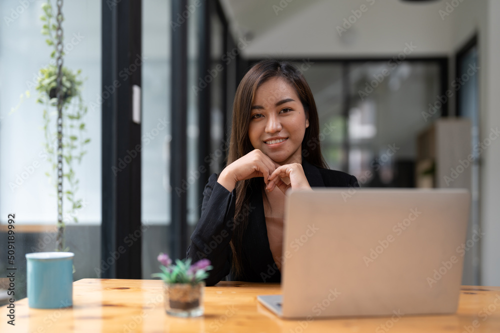 Portrait of young asian woman freelance online working from home with laptop computer. Portrait of young asian woman freelance online working from home with laptop computer.
