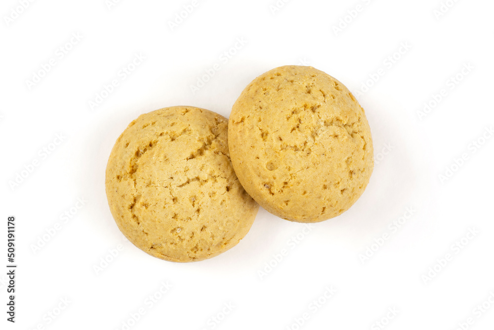 Two round oatmeal cookies for a baby close-up on a white isolated background. Two round oatmeal cookies for a baby close-up on a white isolated background.