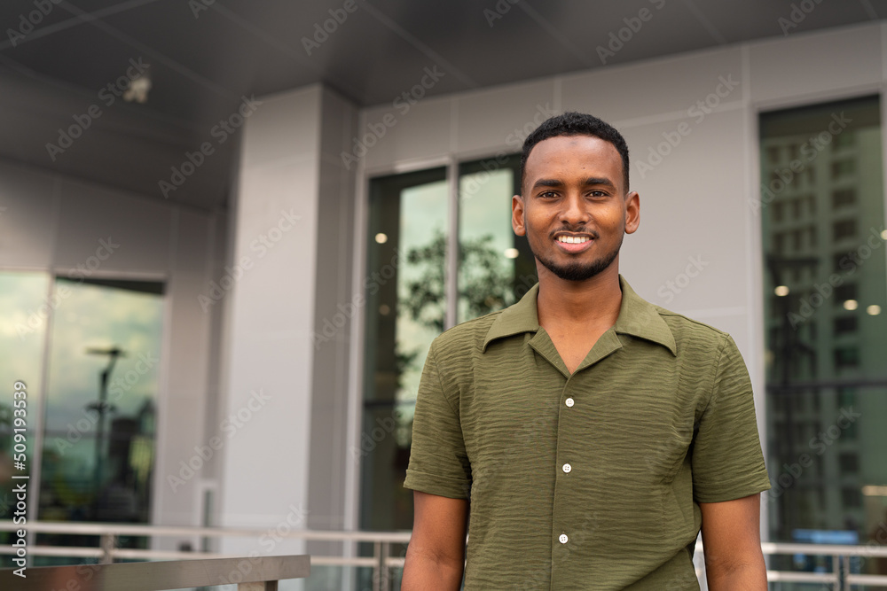 Portrait of handsome young black man outdoors in city Portrait of handsome young black man outdoors in city