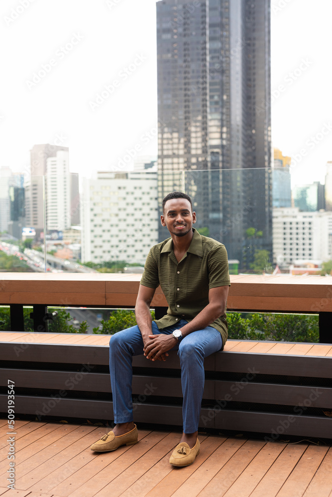 Portrait of handsome young black man outdoors in city Portrait of handsome young black man outdoors in city