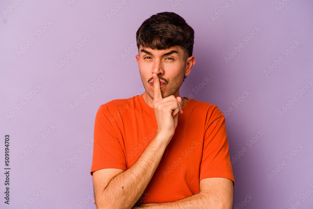 Young caucasian man isolated on purple background keeping a secret or asking for silence. Young caucasian man isolated on purple background keeping a secret or asking for silence.