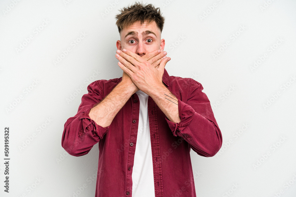 Young caucasian man isolated on white background covering mouth with hands looking worried. Young caucasian man isolated on white background covering mouth with hands looking worried.