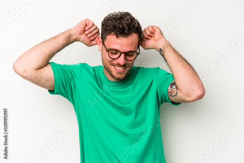 Young caucasian man isolated on white background celebrating a special day, jumps and raise arms with energy.