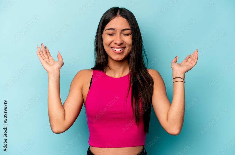 Young hispanic woman isolated on blue background joyful laughing a lot. Happiness concept. Young hispanic woman isolated on blue background joyful laughing a lot. Happiness concept.