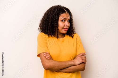 Young African American woman isolated on white background unhappy looking in camera with sarcastic expression.