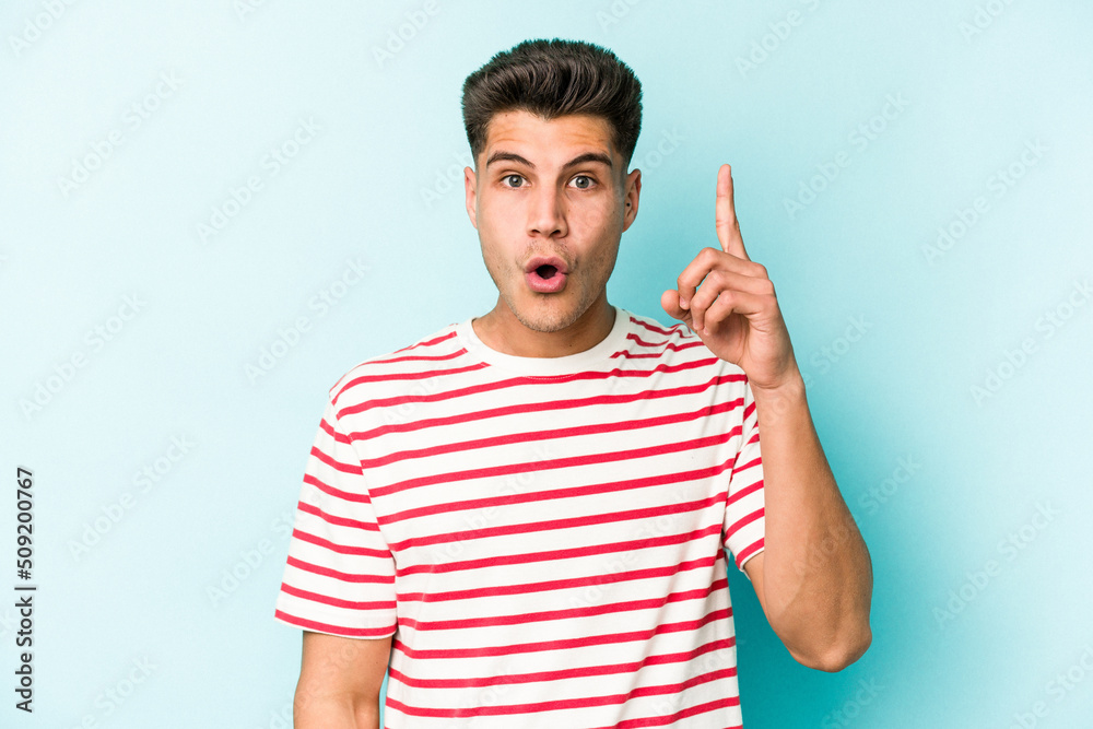 Young caucasian man isolated on blue background having an idea, inspiration concept. Young caucasian man isolated on blue background having an idea, inspiration concept.