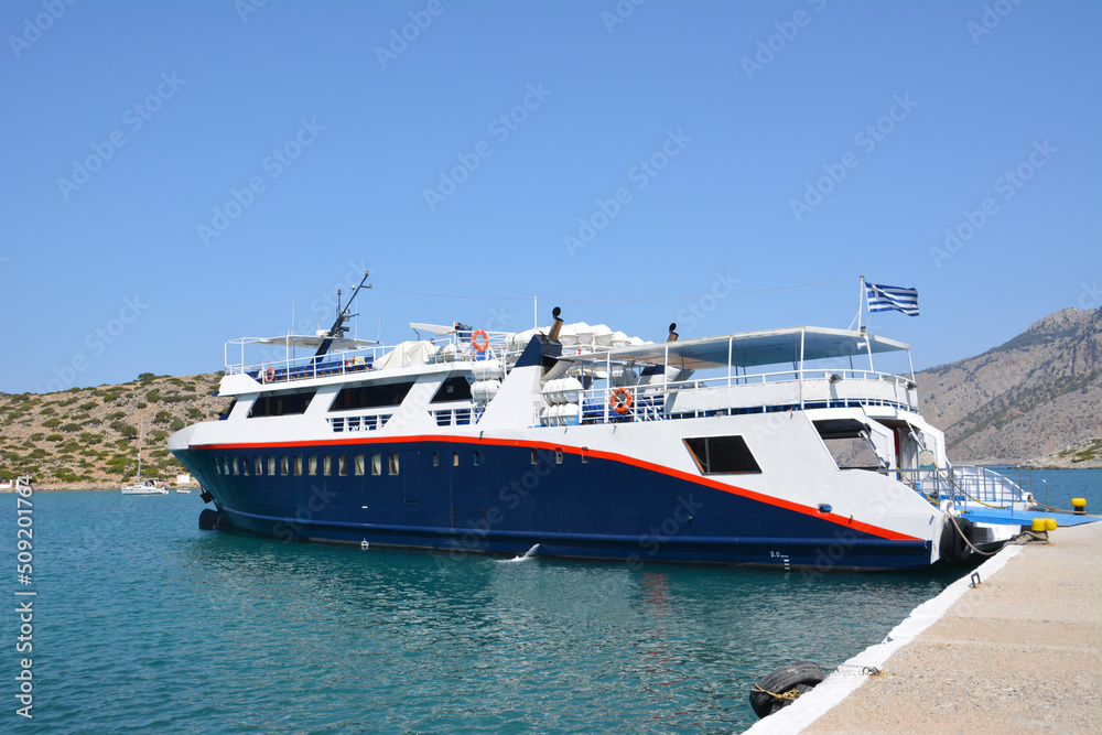 white and blue ferryboat in aegean sea, close-up