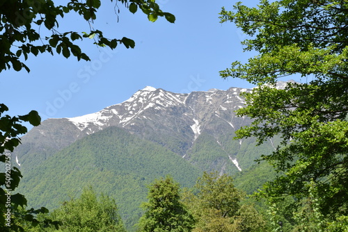 Tops of snowy mountains in summer