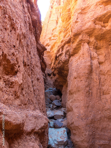 Red rocks and a passage between rocks. Clay canyons. Issyk-Kul region in Kyrgyzstan. Travel and tourism