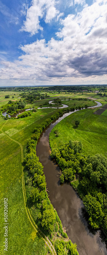 Fotografie Panoramic Image of Curvy Nida River at Spring, Poland. Drone View