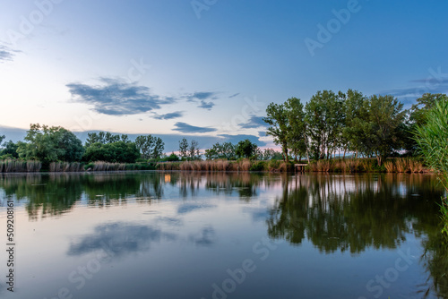 Scenic landscape at Bokod lake in Hungary, dramatic sky