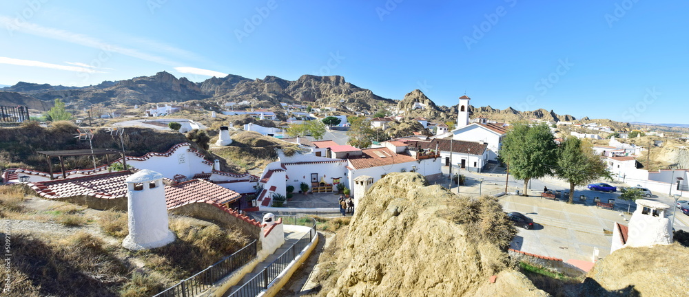Obraz premium Guadix, Spain - 09 november 2019: View from the hill to Guadix, is famous for its cave houses. These cave houses are up in the hills and are in the Troglodyte Quarter (Barrio Troglodyte) of the city