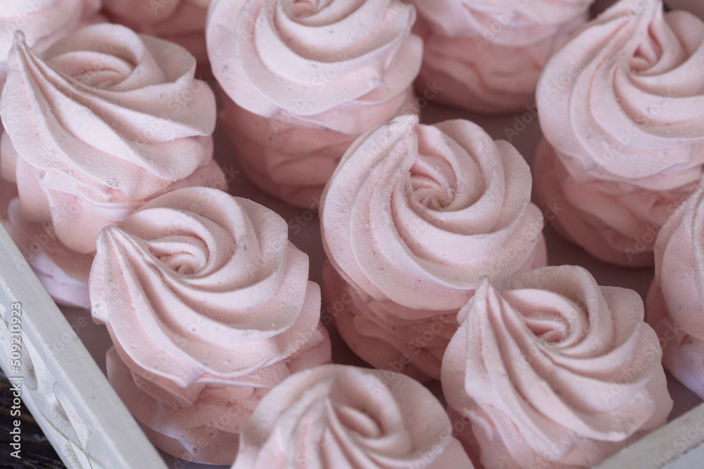 Homemade marshmallows are laid out on a tray. Homemade natural marshmallow. Close-up. Homemade marshmallows are laid out on a tray. Homemade natural marshmallow. Close-up.