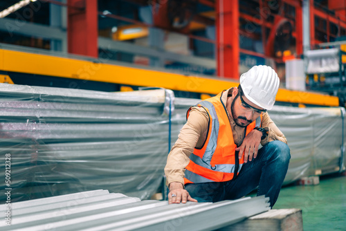 Portrait professional confident Asian man industrial engineer/worker/technician with safety hardhat are check, inspect metal sheet for quality control in production steel manufacture factory plant