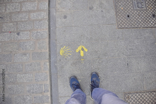 Valencia, Spain - 11 november 2019: The sign of the direction of the way of St. James on the sidewalk