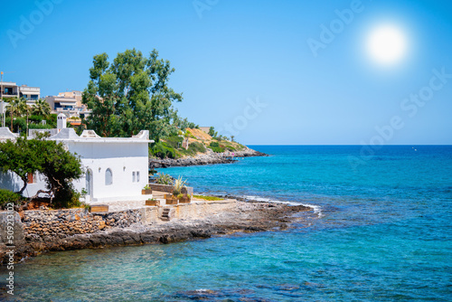 Sea landscape with white ancient beach house. Travel, summer holiday concept. Horizontal image. © zwiebackesser