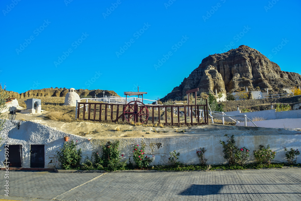 Obraz premium Guadix, Spain - 09 november 2019: The territory of the hotel with rooms in the rock