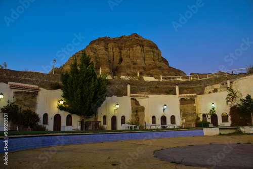 Guadix, Spain - 08 november 2019: The territory of the hotel with rooms in the rock, night shot