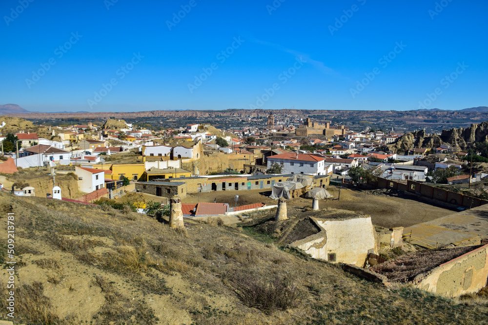 Guadix, Spain - 09 november 2019: View from the hill to Guadix, is famous for its cave houses. These cave houses are up in the hills and are in the Troglodyte Quarter (Barrio Troglodyte) of the city