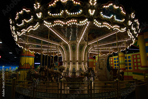 Photo children's carnival carousel with horses