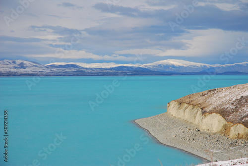 Aqua lake with snow capped mountains, Lake Pukaki at Mt Cook in the South Island of New Zealand