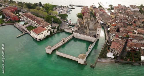 Aerial view at Scaligero Castle on a misty evening at dusk.