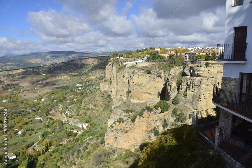 Fototapeta premium Ronda, Andalusia, Spain - 08 november 2019: View of the valley and the rocks at the foot of the town of Ronda