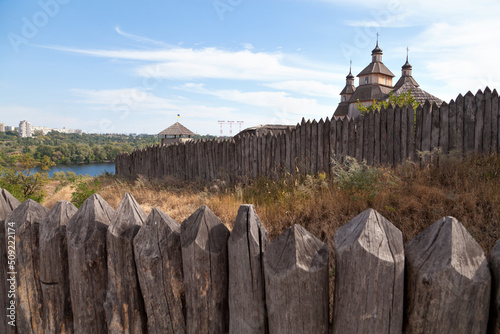 Принти на полотні Ukrainian island of Hortitsa on the Dnipro river with ancient buildings, walls and churches on background of modern city Zaporizhzhia