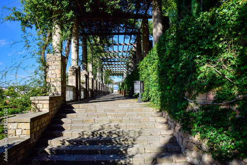 Photography Barcelona, Spain - October 3 2019: Stone staircase and arches with columns with