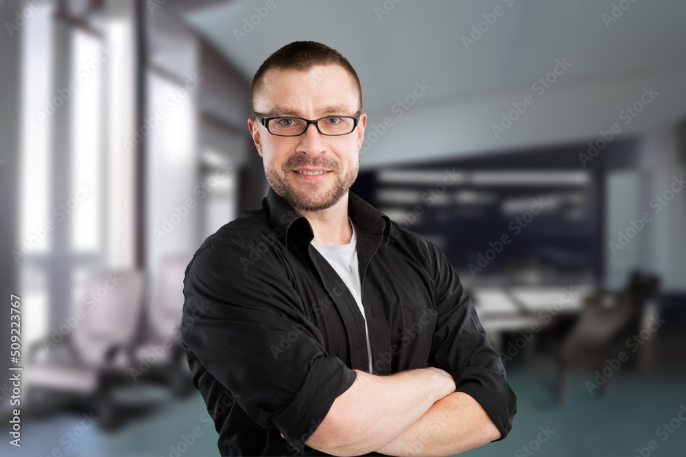 Fototapeta premium Happy mature male business leader standing at office window. Job success concept