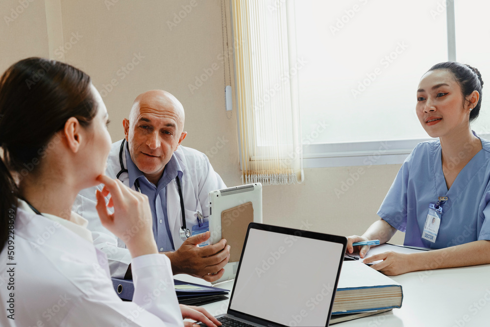 Fototapeta premium Team doctor, nurse and internship doctor talking and discussing about surgery treatment patient’s case while sitting in the meeting room office in hospital. healthcare and medical concept.